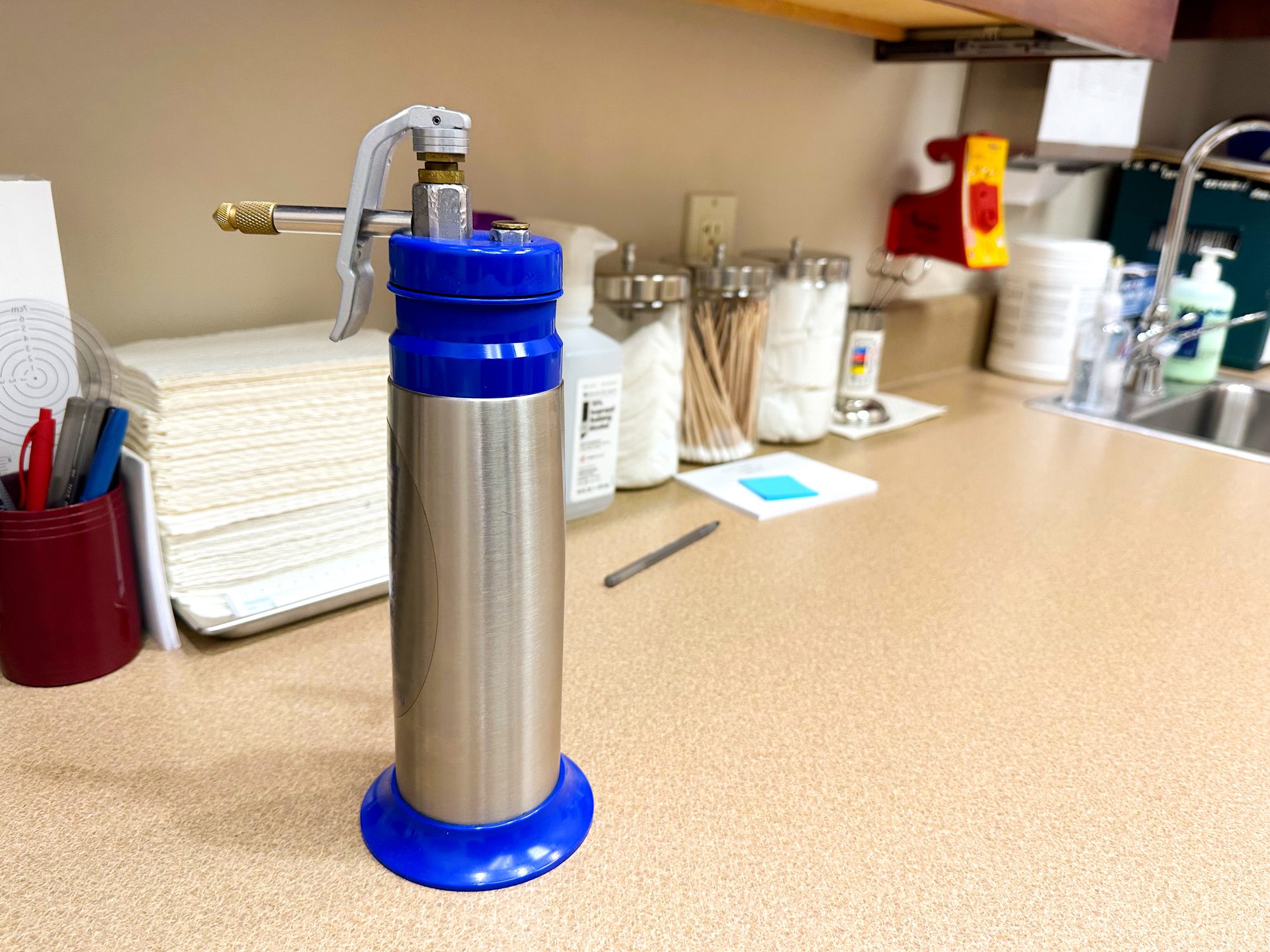 Can of liquid nitrogen for cryosurgery and skin treatments in the dermatologist office Can of liquid nitrogen for cryosurgery and skin treatments