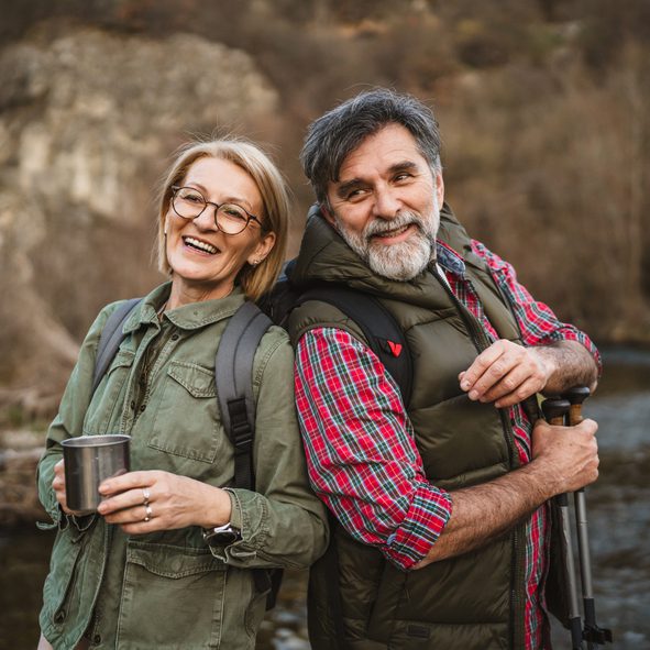 portrait of couple husband and wife hiker enjoy together in nature