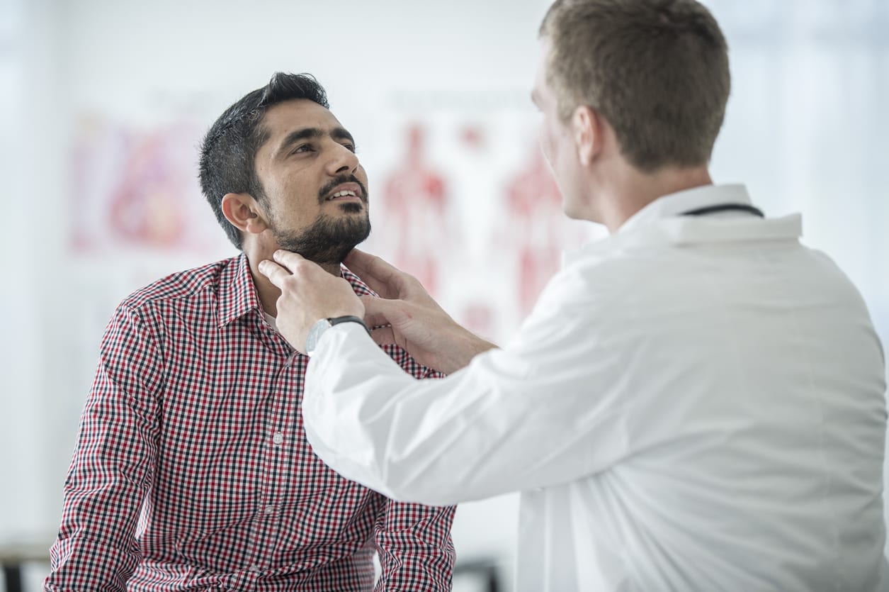 x-rays Doctor checking the thyroid gland of a patient